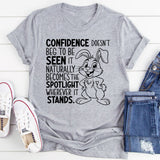 Confidence Doesn’t Beg to Be Seen, It Naturally Becomes the Spotlight Wherever It Stands T-Shirt